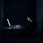 12709 Internet marketing beginner working alone late at night feeling isolated