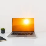 62709 Sunrise over laptop symbolizing hope and Internet Profit Success for beginners.