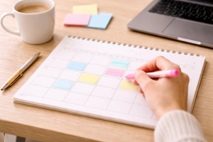 Weekly planner and workspace representing consistent content creation habits.
