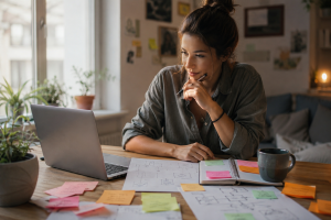 Beginner marketer planning storytelling techniques in marketing at a laptop