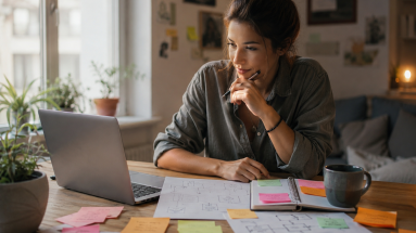 Beginner marketer planning storytelling techniques in marketing at a laptop