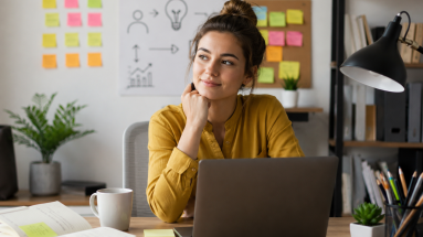 Beginner marketer using copywriting frameworks to plan better ads at a laptop.